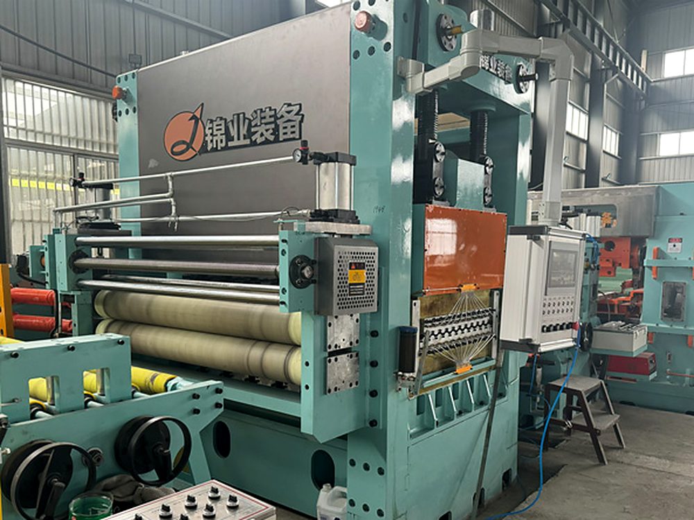 Coil processing line arranged in a workshop, with the line running from decoiler to stacker.