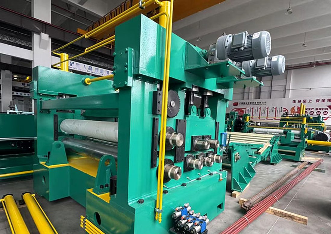 Coil processing equipment set up in a workshop for a customized line configuration.